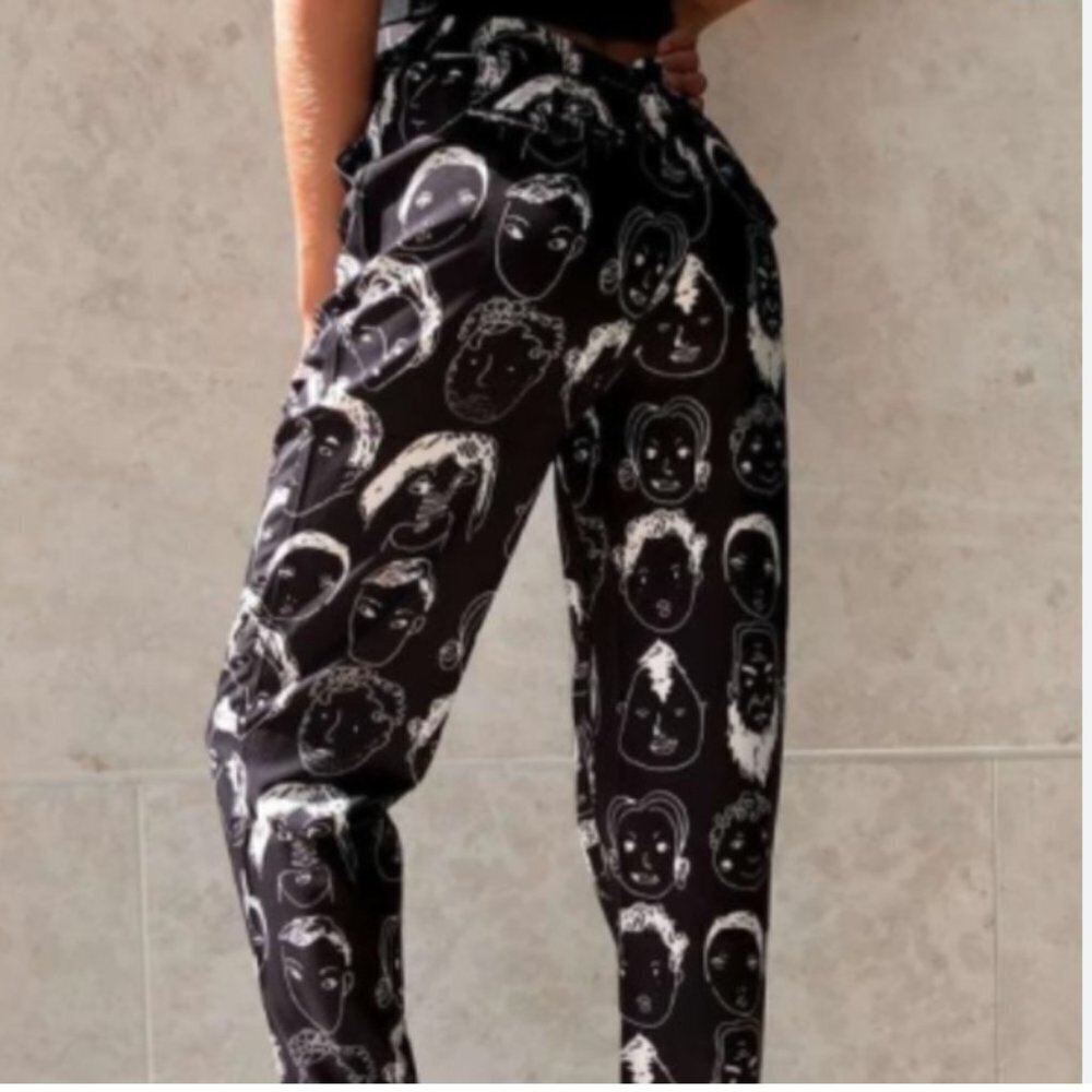 Urban Outfitters Shekou X-Small black pants with white faces EUC silky material